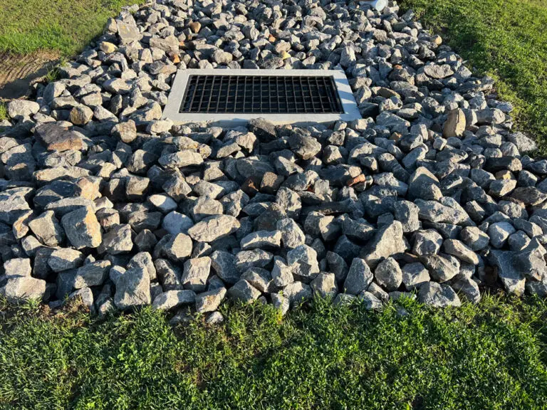 Drain-Rock- Drain rock around a metal grate drain
