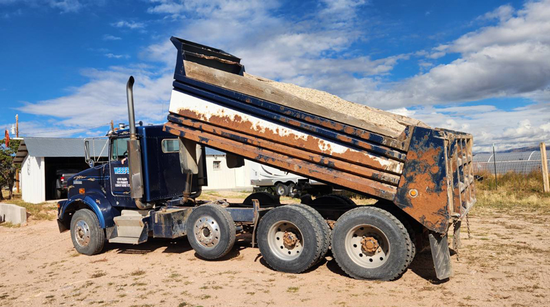 A dump truck from Webb's Select A service loaded with gravel