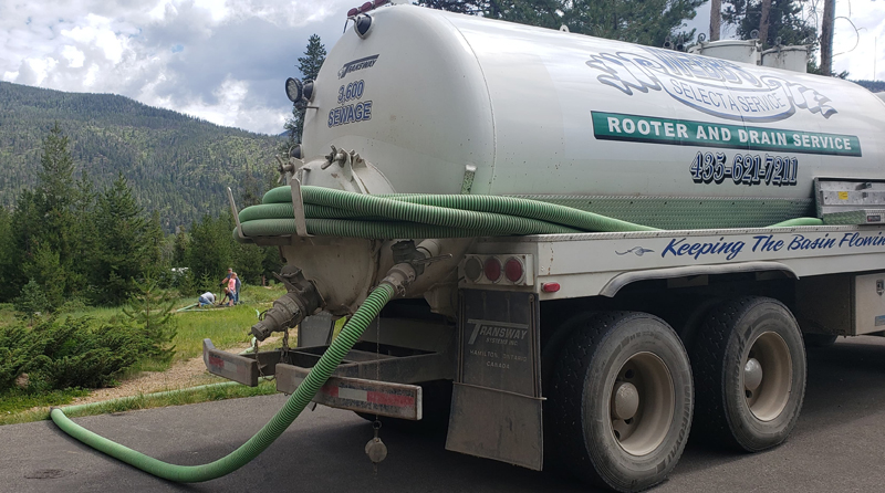Webb's Select-A-Service septic pump truck at a job site