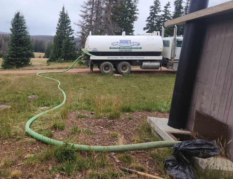 Webb's Select-A-Service truck pumping a septic tank at a state park