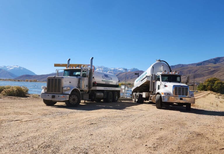 Webb's Select-A-Service Trucks by a lake